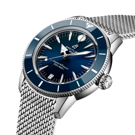 side view of Breitling Superocean Heritage stainless steel case blue bezel mesh bracelet detail