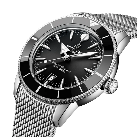 side view of Breitling Superocean Heritage stainless steel case black ceramic bezel mesh bracelet detail