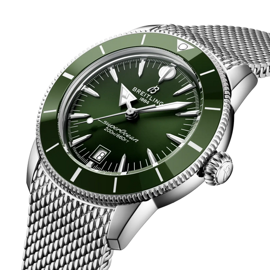 side view of Breitling Superocean Heritage stainless steel case green ceramic bezel mesh bracelet detail