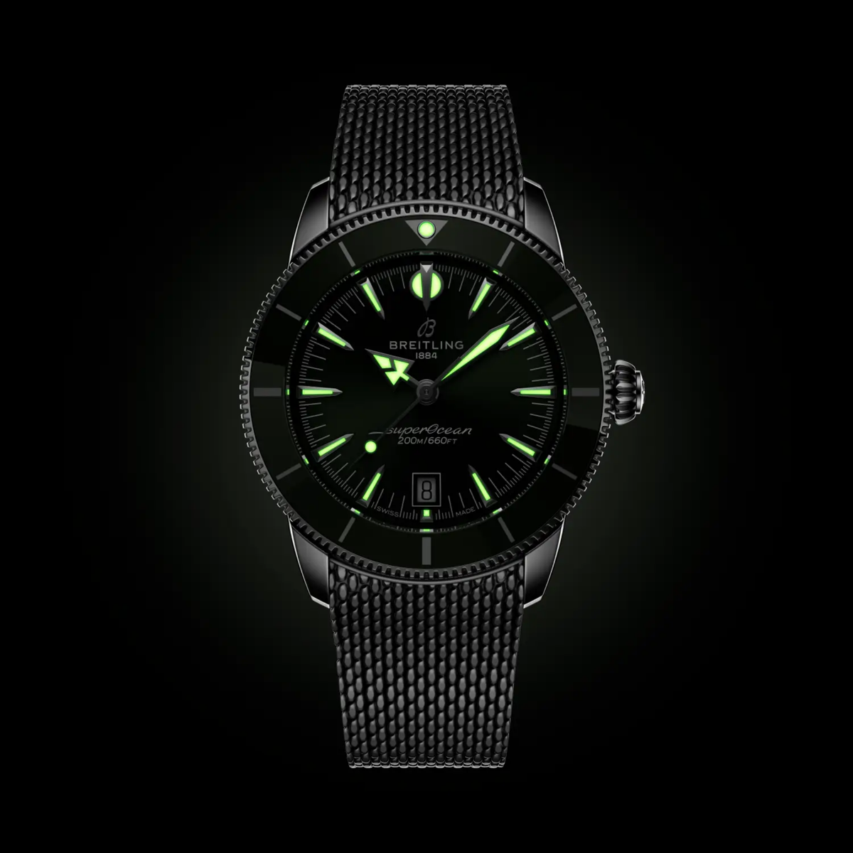 Breitling Superocean Heritage green dial watch glowing in the dark with luminous hands and hour markers illuminated