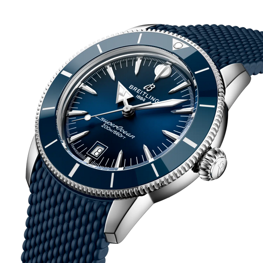 side view of Breitling Superocean Heritage stainless steel case with blue ceramic bezel and textured rubber strap
