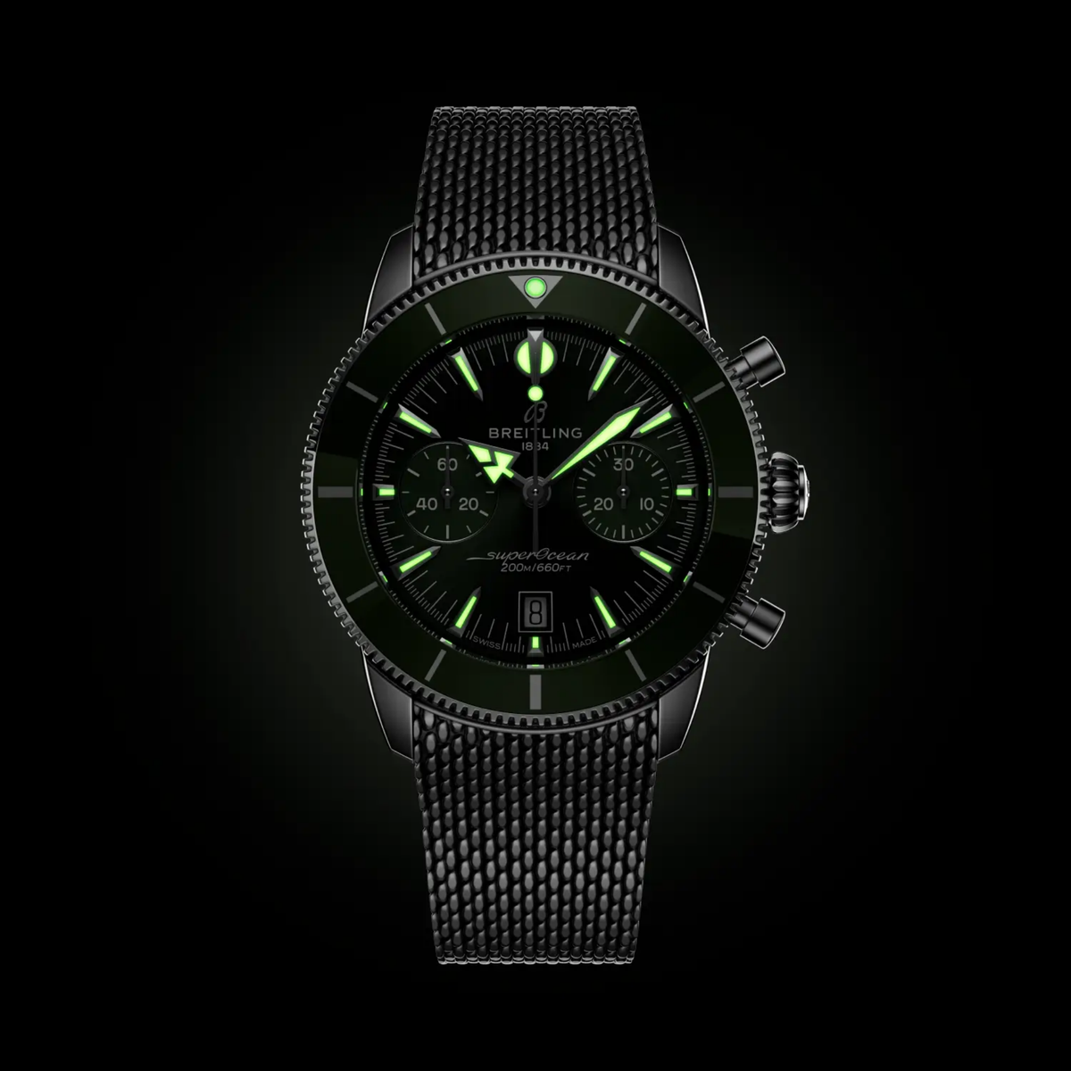 Breitling Superocean Heritage Chronograph green dial watch glowing in the dark with luminous hands, hour markers and subdials clearly visible