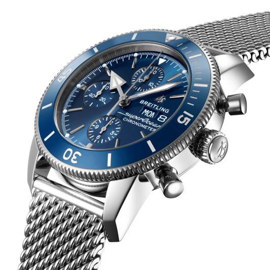 side view of Breitling Superocean Heritage Chronograph stainless steel case with blue ceramic bezel and chronograph pushers

