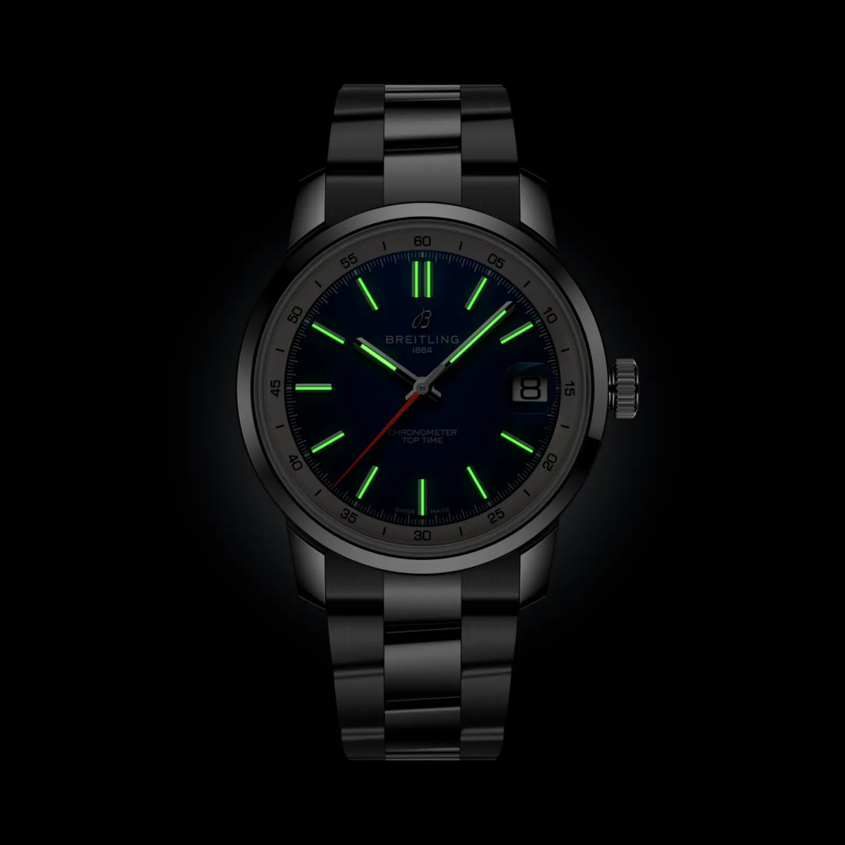 Breitling Top Time blue dial watch glowing in the dark with luminous hands and hour markers for clear visibility at night