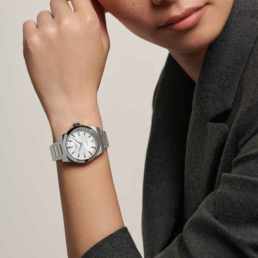 Longines Conquest Automatic stainless steel watch worn on the wrist with a clean silver dial and sporty everyday styling
