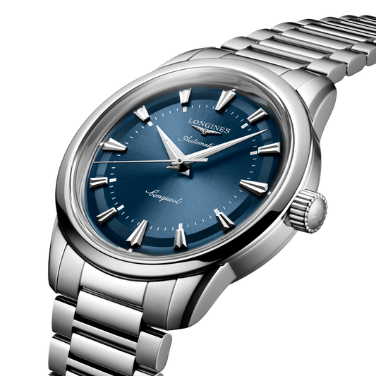 Longines Conquest blue dial watch styled on the wrist with a stainless steel bracelet for a modern everyday luxury look
