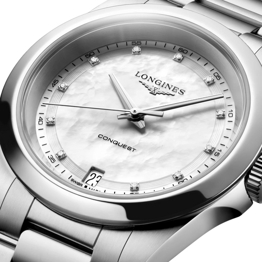 Longines Conquest 34mm watch featuring an elegant white mother-of-pearl dial, scratch-resistant sapphire crystal and stainless steel bracelet.