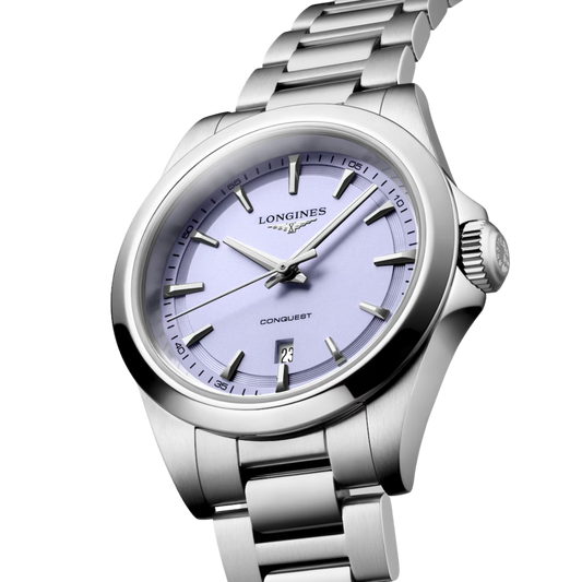 Elegant yet sporty, this Longines Conquest features a 30mm stainless steel case, quartz movement and a distinctive lavender dial for effortless everyday style.