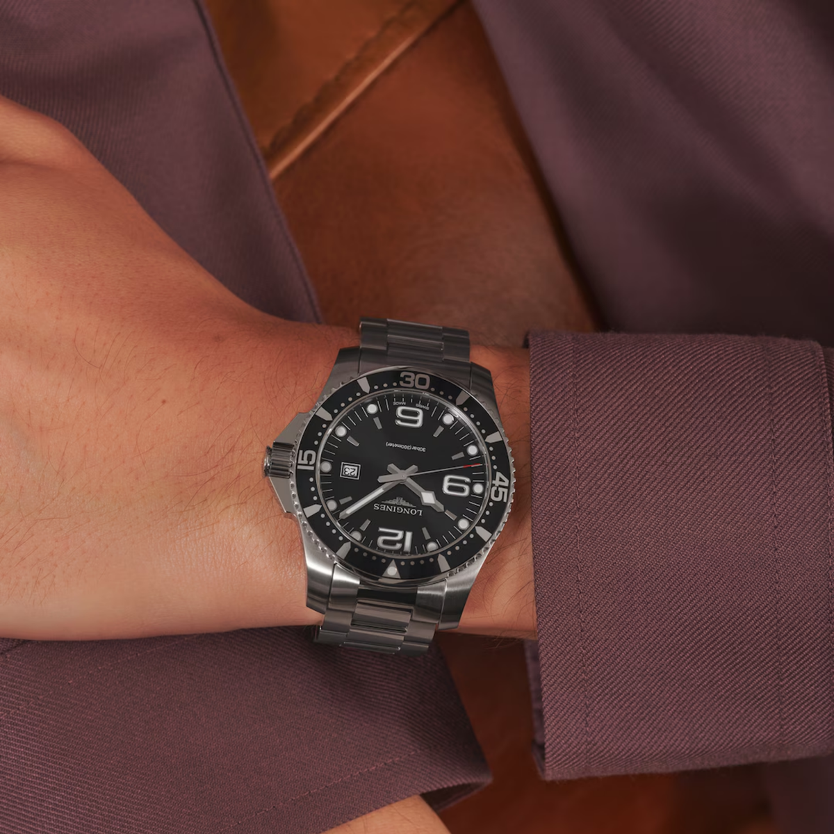 Longines HydroConquest automatic dive watch featuring a sunray black dial and stainless steel case