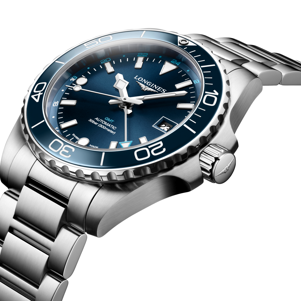 close up of the Longines HydroConquest GMT blue sunray dial with luminous markers, GMT hand and date display
