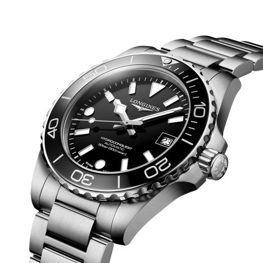 Longines HydroConquest sports watch worn on the wrist featuring a black dial, rotating bezel and brushed stainless steel bracelet
