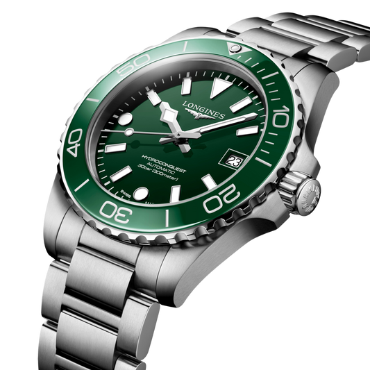 close up of the Longines HydroConquest green sunray dial featuring luminous hands, oversized hour markers and date display
