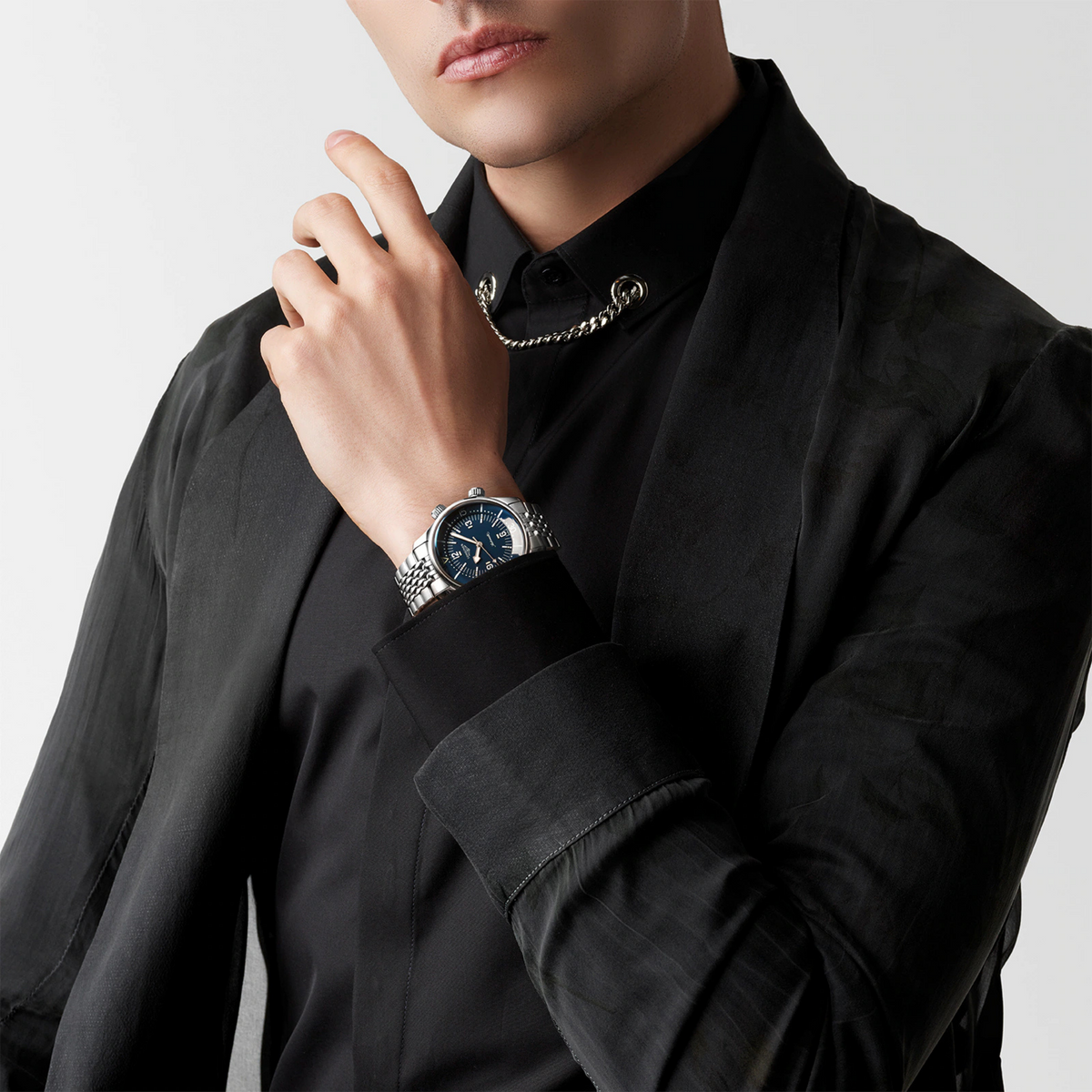 Longines Legend Diver blue dial dive watch worn on the wrist with a stainless steel bracelet and vintage inspired styling
