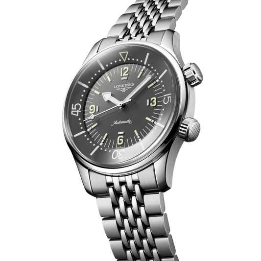 close up of the Longines Legend Diver black dial featuring luminous markers, internal rotating bezel and oversized Arabic numerals
