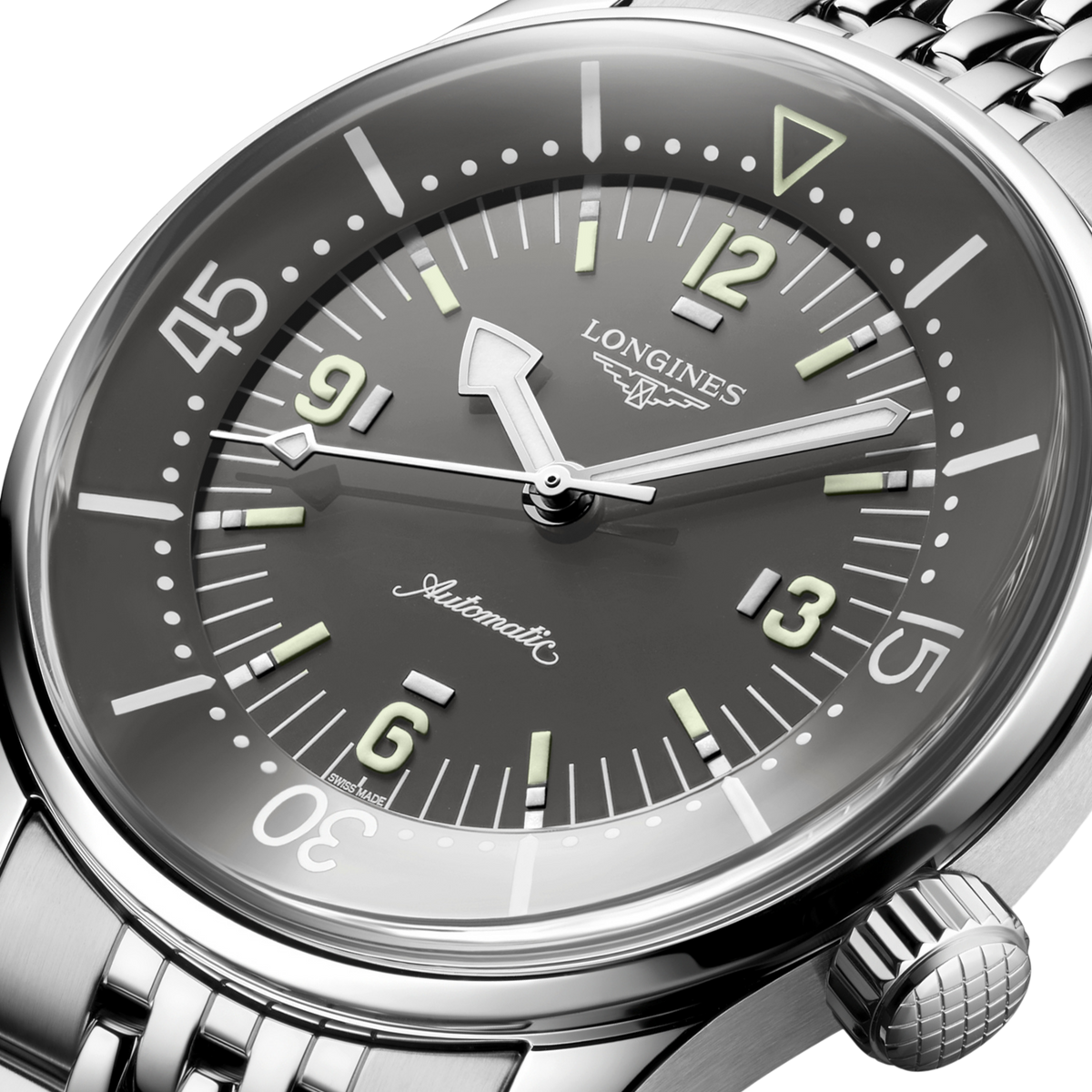 Longines watch with a dark gray dial and silver bracelet on a clear background
