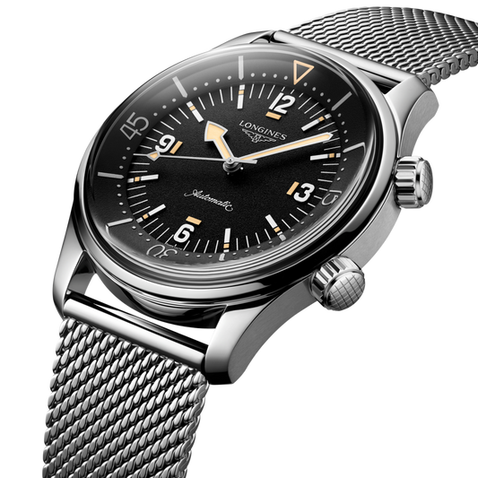 close up of the Longines Legend Diver black dial featuring luminous markers, internal rotating bezel and oversized Arabic numerals
