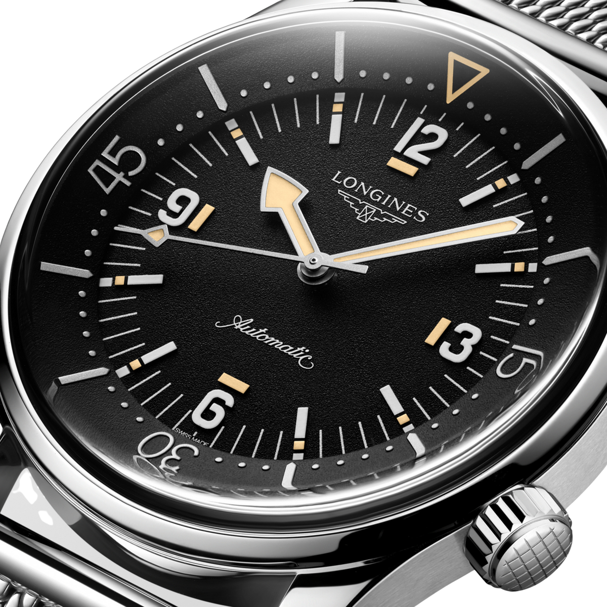 back of Longines Legend Diver automatic watch showing the engraved stainless steel case back and mesh bracelet detail
