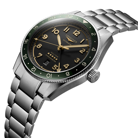 side view of Longines GMT watch case, crown and brushed stainless steel profile with green bezel detail

