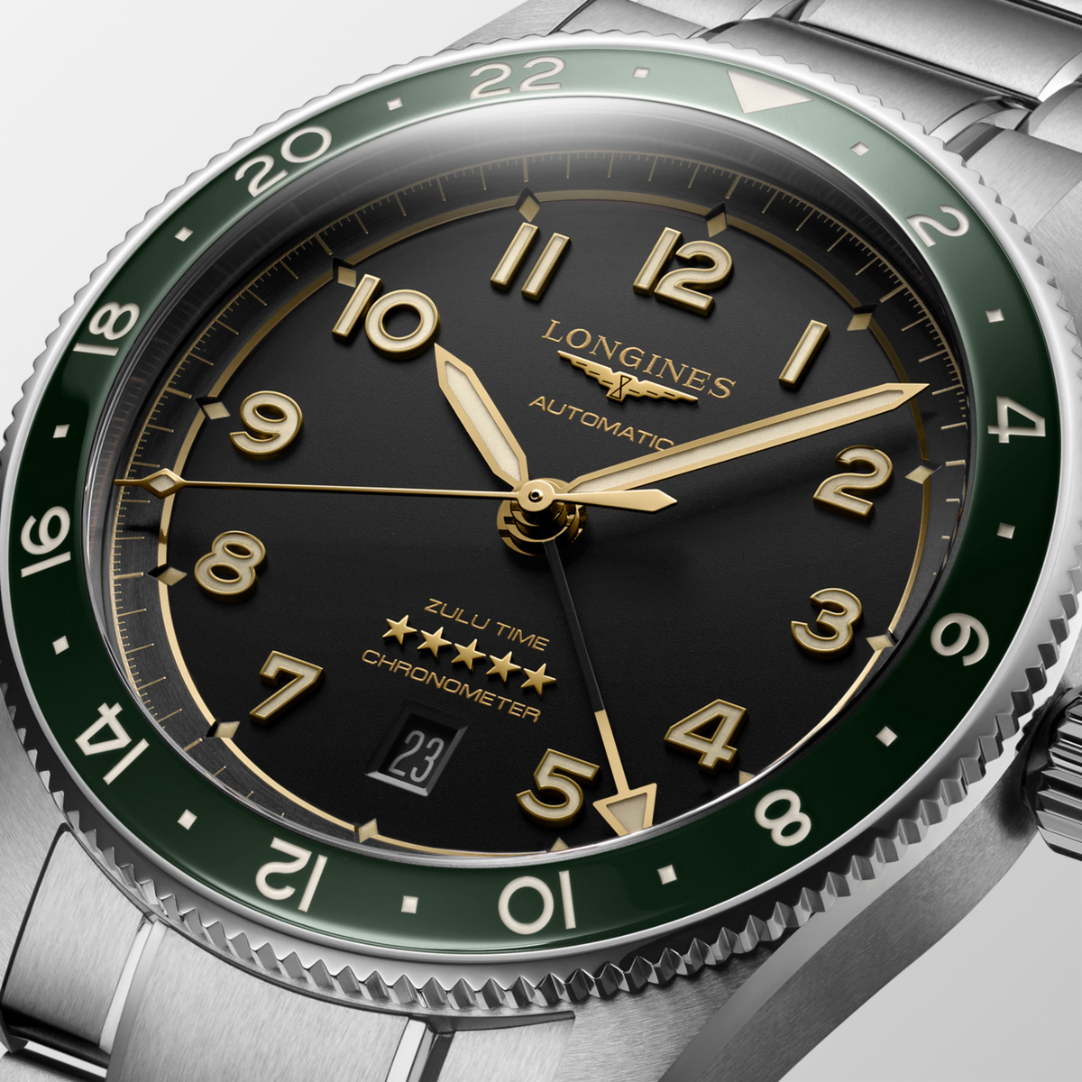 Longines watch with green and silver accents on a light gray background