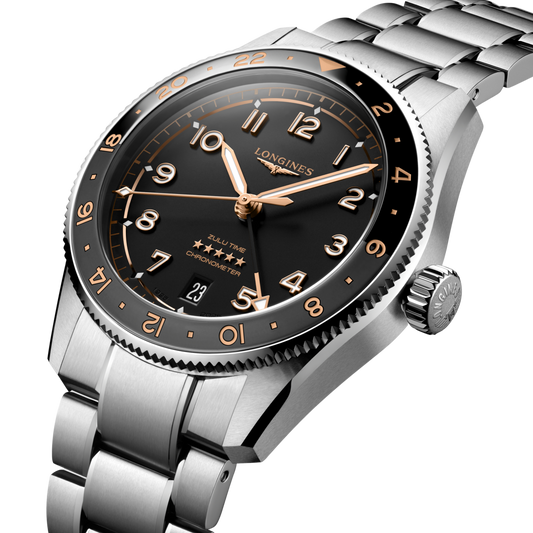 Silver watch with black dial and rose gold accents on a clear background