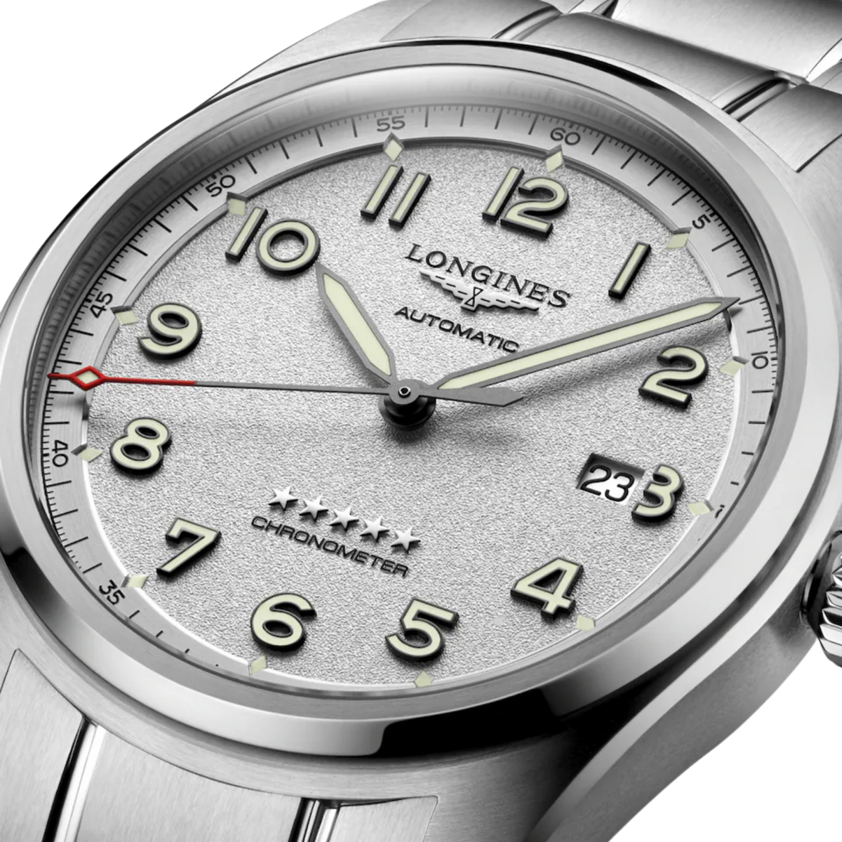 side view of Longines Spirit watch case, crown and brushed stainless steel profile

