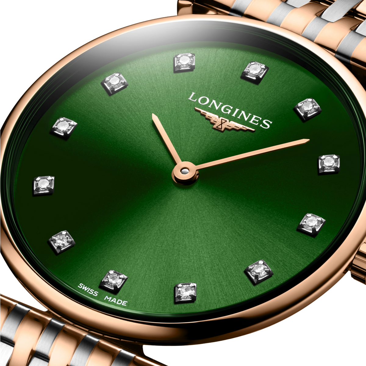 Longines La Grande Classique green dial dress watch worn on the wrist with a rose gold and stainless steel bracelet
