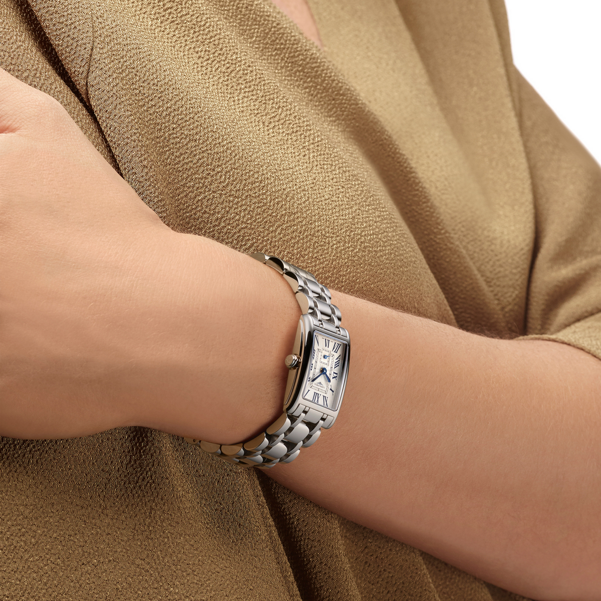 Longines DolceVita stainless steel watch styled on the wrist with an elegant rectangular case and polished bracelet
