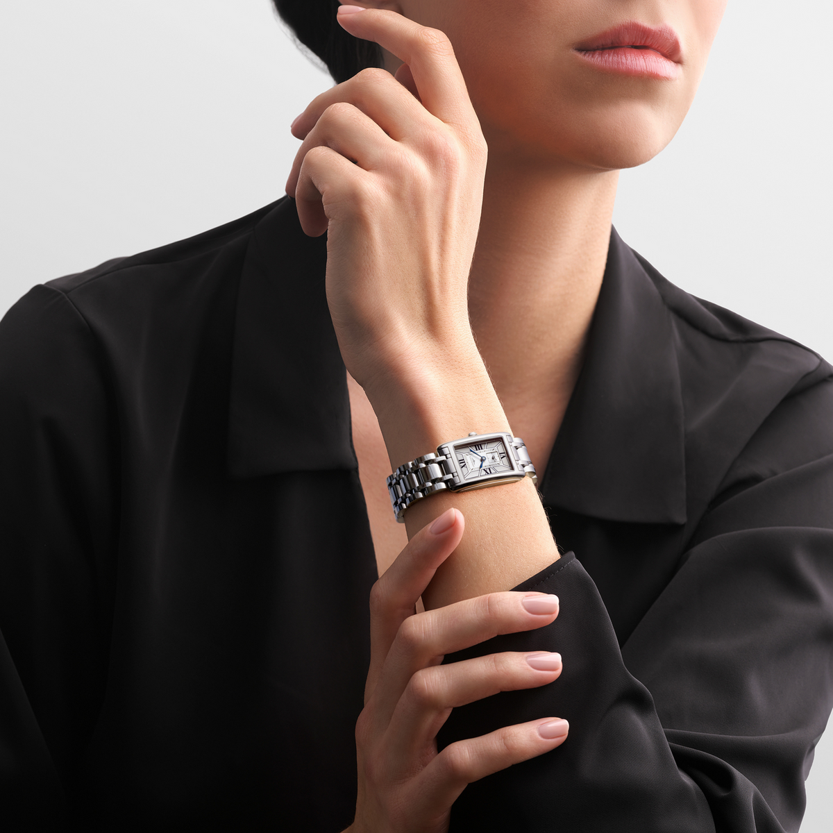 Longines DolceVita stainless steel watch styled on the wrist with an elegant rectangular case and polished bracelet
