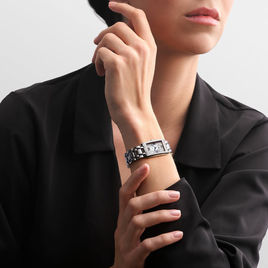 Longines DolceVita stainless steel watch styled on the wrist with an elegant rectangular case and polished bracelet
