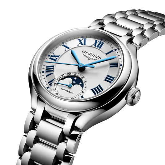 lifestyle image of Longines silver dial moonphase watch worn on a wrist highlighting the blue hands and Roman numeral markers
