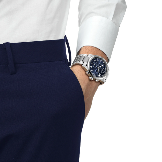 the watch worn on the wrist, showcasing the vibrant blue chronograph dial, sturdy stainless steel bracelet, and confident sporty aesthetic suited to versatile daily wear
