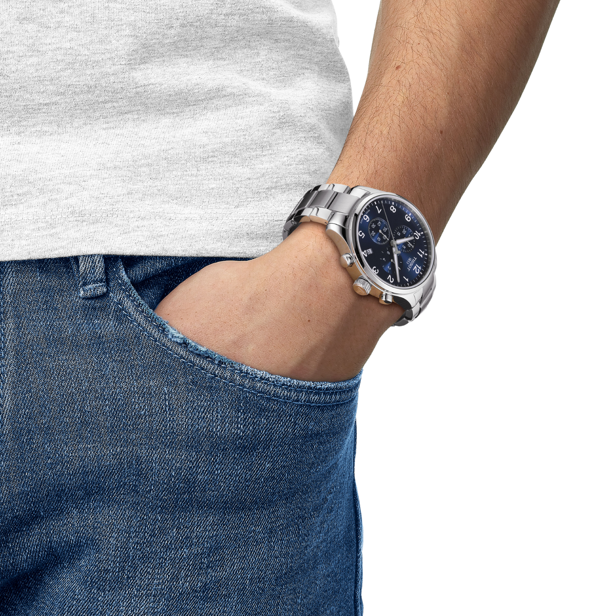the watch worn on the wrist, showcasing the substantial stainless steel case, chronograph sub-dials, and easy-to-read blue dial designed for versatile daily and weekend styling