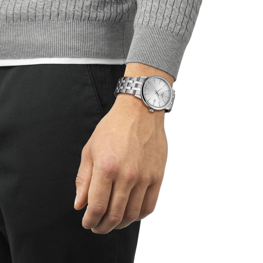 the watch worn on the wrist, showcasing the understated silver dial, polished stainless steel bracelet, and versatile smart-casual aesthetic suited to everyday wear