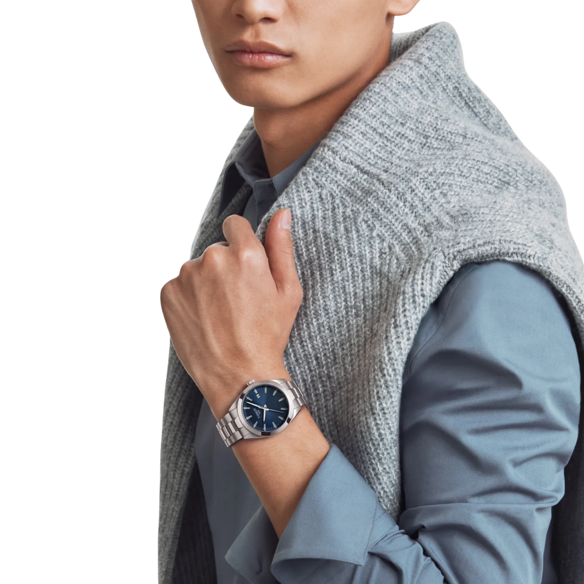 Tissot Gentleman blue dial watch on stainless steel bracelet.