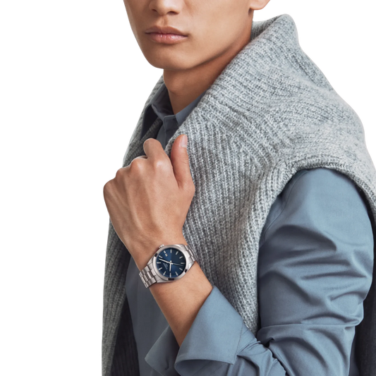 Tissot Gentleman blue dial watch on stainless steel bracelet.