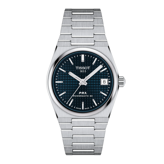 Tissot PRX Powermatic 80 stainless steel watch featuring a deep blue waffle-textured dial, silver-tone baton hour markers, and a date window at 3 o’clock, finished with the signature integrated stainless steel bracelet