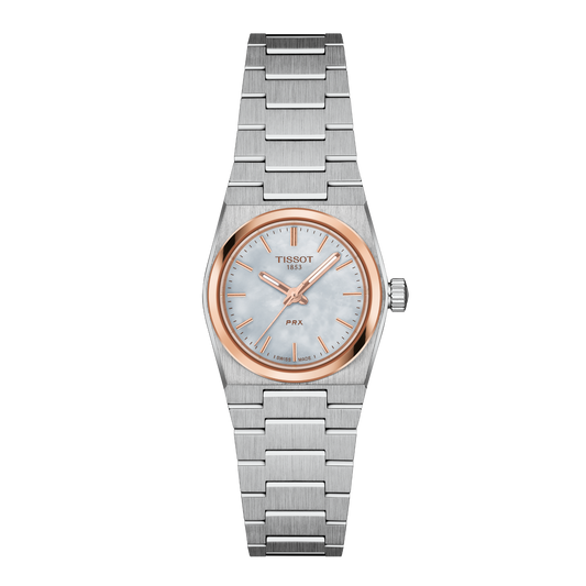Tissot PRX two-tone stainless steel watch featuring a soft mother-of-pearl dial, slim rose gold-tone baton hour markers, and a polished rose gold bezel, finished with a sleek integrated steel bracelet