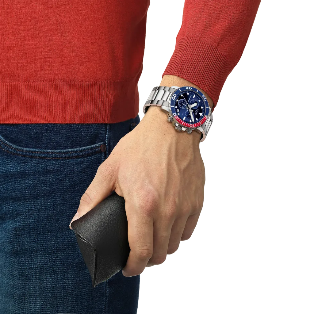 the watch worn on the wrist, showcasing the substantial stainless steel case, chronograph sub-dials, and robust diver styling suited to active everyday and water-sport wear