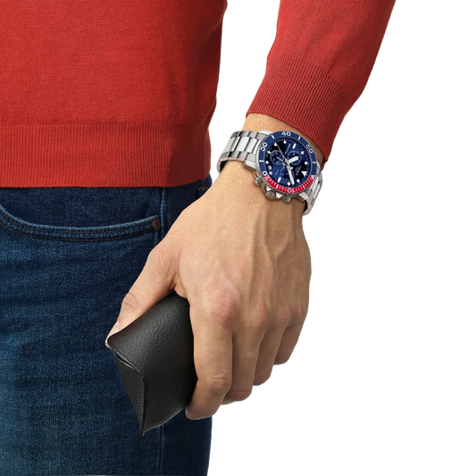 the watch worn on the wrist, showcasing the substantial stainless steel case, chronograph sub-dials, and robust diver styling suited to active everyday and water-sport wear