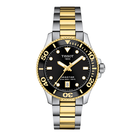 Tissot Seastar two-tone diver’s watch featuring a bold black dial with gold-tone luminous hands and hour markers, a black unidirectional bezel with gold detailing, and a two-tone stainless steel bracelet for a sporty luxury finish