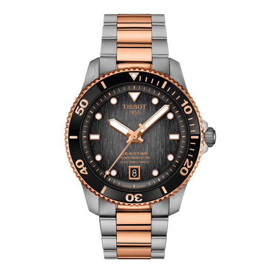 Tissot Seastar Powermatic 80 Black Dial Watch featuring a textured black dial, black diving bezel with rose gold-tone detailing, and a two-tone stainless steel bracelet for a bold sporty-luxury finish