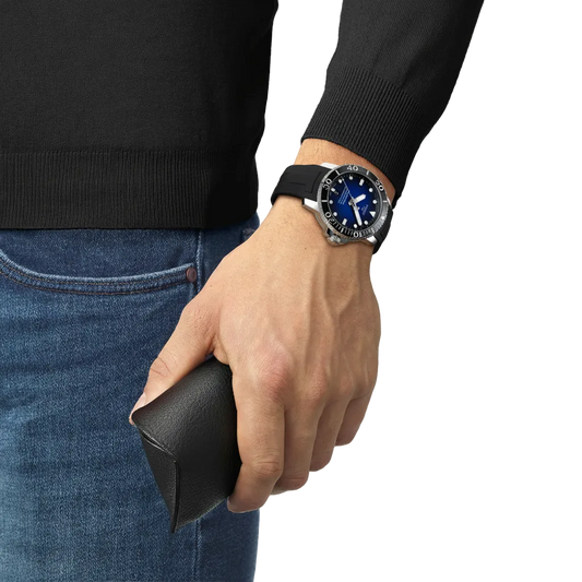 the watch worn on the wrist, showcasing the substantial diver-style case, high-contrast luminous markers, and comfortable rubber strap suited to active lifestyles and water sports