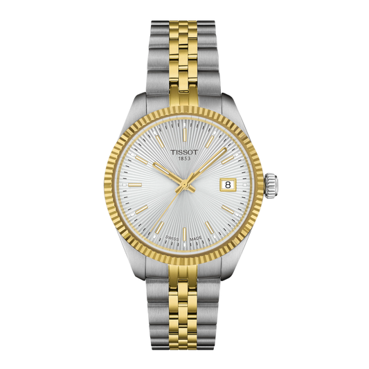 Silver and gold watch with Tissot logo on a white background