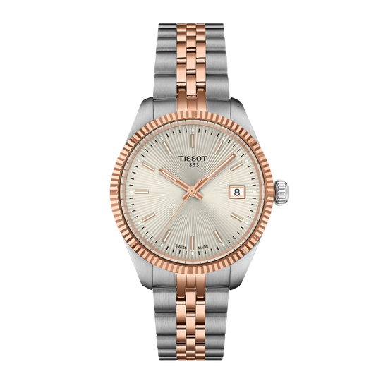 The silver dial features a traditional guilloché pattern with radiating sunbeam detailing, complemented by rose gold-tone index hour markers and hands. 