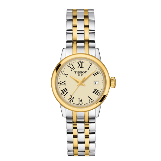 Tissot two-tone stainless steel watch featuring a classic champagne dial, black Roman numeral hour markers, and a polished gold-tone bezel, finished with a refined steel and gold bracelet