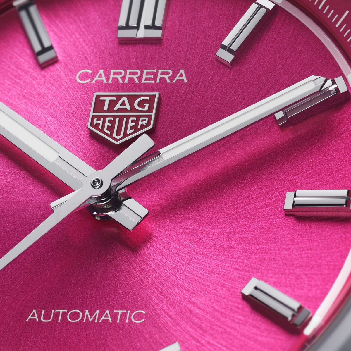 full view of the Carrera highlighting the smooth polished bezel, clean case design and brushed stainless steel bracelet