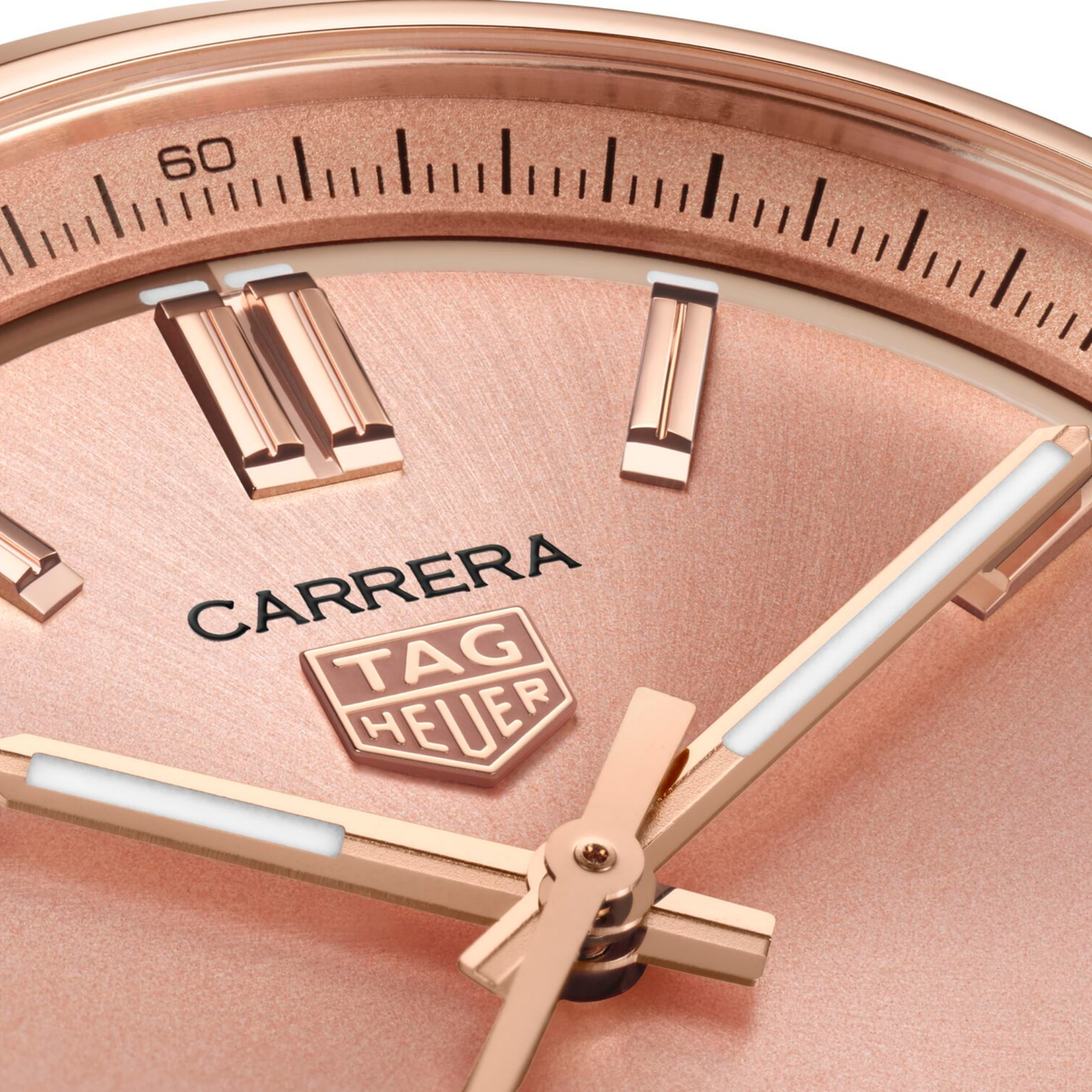 close-up of the rose gold dial highlighting the sunray finish, applied indices, sleek handset and date window at 6 o’clock
