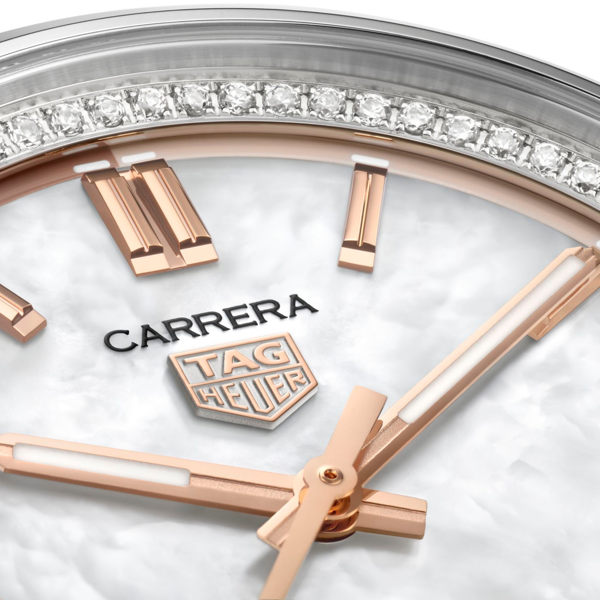 close-up of the mother-of-pearl dial highlighting its natural shimmer, rose gold-tone indices, handset and date window at 6 o’clock