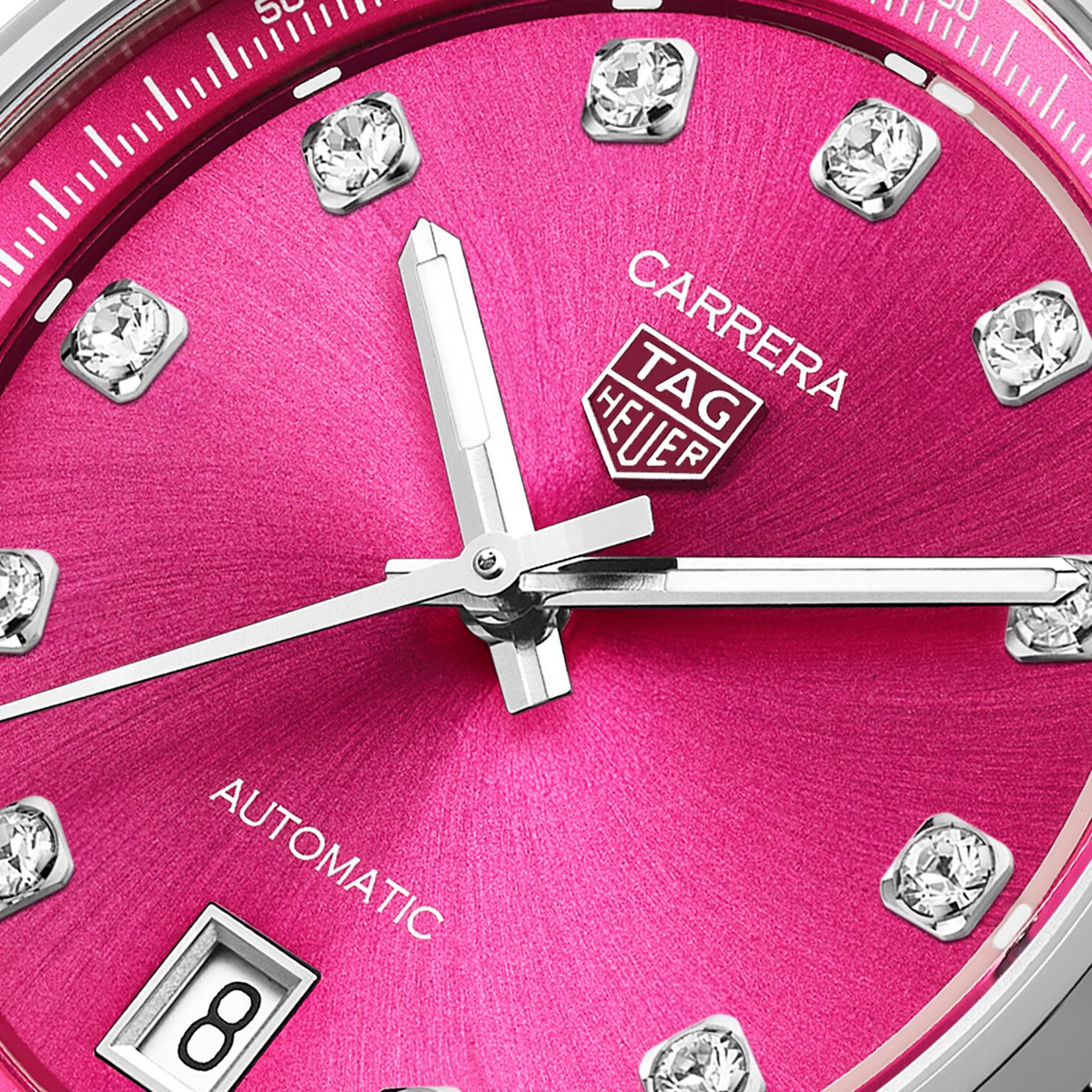 close-up of the pink dial highlighting the sunray finish, diamond hour markers, applied logo and refined handset