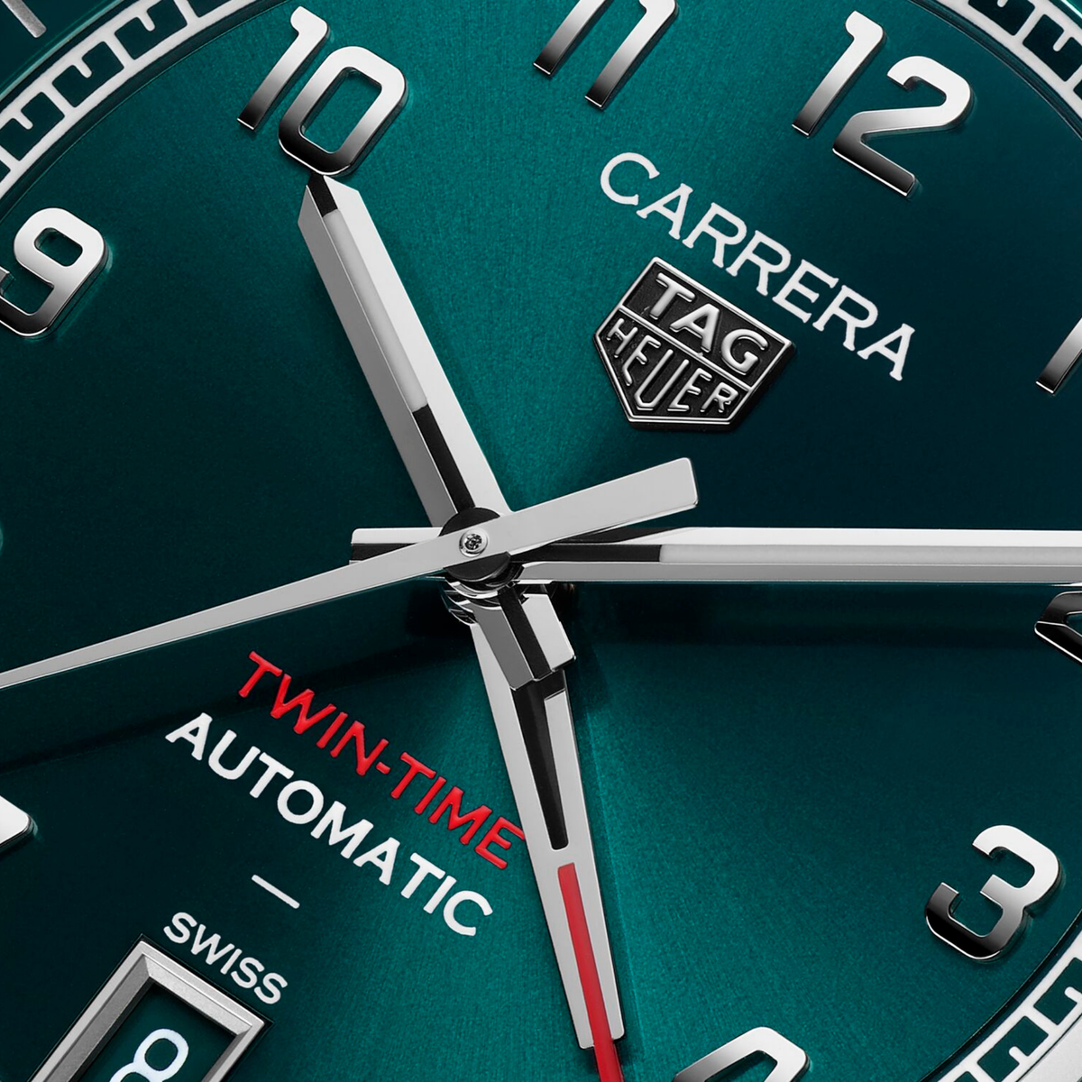 close-up of the green dial highlighting the smooth finish, bold numerals, inner 24-hour scale and red GMT hand